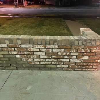 Romero Landscaping - After photo of the rebuilt brick wall with the bushes removed - Landscaping Near Me - San Bernardino, California