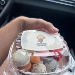 a person holding a container of food a person holding a container of food