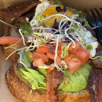 Cafe Dolce - Avocado toast, added an egg and bacon. - Coffee & Tea Near Me - Solvang, California Cafe Dolce - Avocado toast, added an egg and bacon. - Coffee & Tea Near Me - Solvang, California