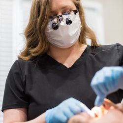 Shane Smith, DDS - Our hygienist showing patients how to floss correctly.