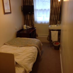 Crescent Hotel - Typical single room (#32) with shower (not visible to left).