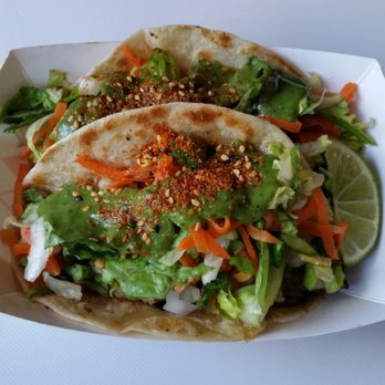 Nom Mi Street - Fish tacos (tilapia) - togarashi, avocado sauce, pickled carrots, lettuce, cilantro, flour tortilla. Ridiculously good. - Vietnamese Near Me