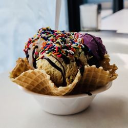 Scoops in Bellevue - Waffle-bowl sundae with three flavors of ice creams, chocolate syrup, whipped cream, and sprinkles