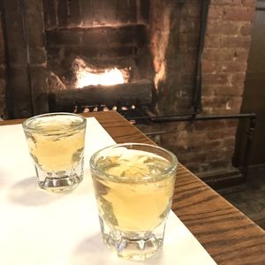 Photo of Reade Street Pub & Kitchen - New York, NY, United States. Whisky by the fireplace