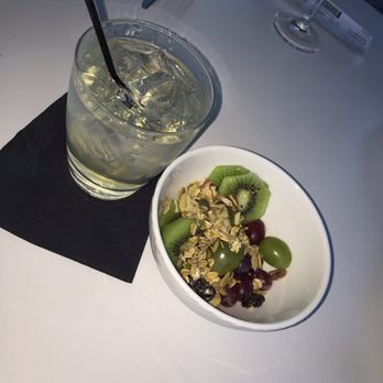 The Centurion Lounge - Granola bowl with fruit and yogurt & a gin cocktail. - Airport Lounges Near Me - Dallas, Texas