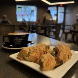 Oat milk cappuccino and spinach/cheese croissant