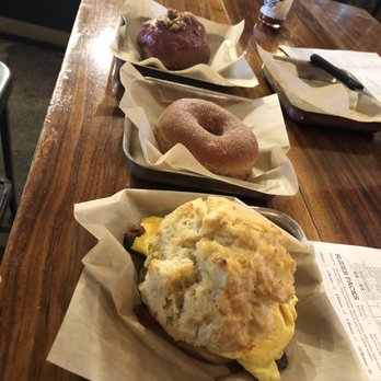 District Donuts Sliders Brew - Raspberry cheesecake donut, cinnamon sugar donut, and bacon, cheese, and egg biscuit! - Donuts Near Me - Jefferson, Louisiana
