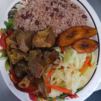 Caribbean's Finest - a plate of food on a table - Caribbean Near Me - Ocala, Florida
