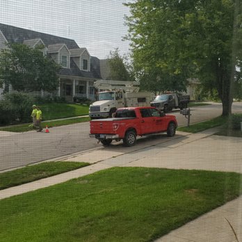 Hathaway Tree Service - a red truck parked in front of a house - Tree Services Near Me - Rochester, Minnesota Hathaway Tree Service - a red truck parked in front of a house - Tree Services Near Me - Rochester, Minnesota