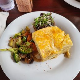 In this photo is their filet minan with ogrotten potato bake and sautéed vegetables. In this photo is their filet minan with ogrotten potato bake and sautéed vegetables.