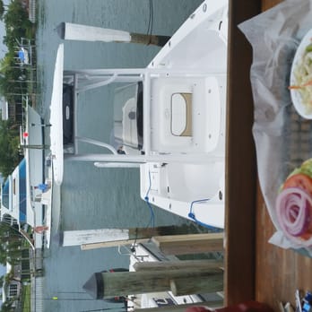 The Wharf - Blackened grouper sandwich with a sweet view! :) - Seafood Near Me - St Pete Beach, Florida