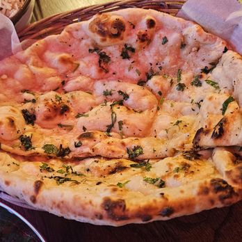 Delhi Belly - Ghee Garlic Naan ($5). Good to pair with entrees. Great flavor. - Indian Near Me - Alhambra, California Delhi Belly - Ghee Garlic Naan ($5). Good to pair with entrees. Great flavor. - Indian Near Me - Alhambra, California