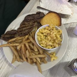 Ribeye with fries, mac and cheese, corn bread