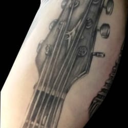 Silverline Tattoo & Body Piercing Studio - Black and gray guitar by Nate.