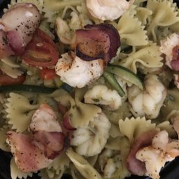 Bow tie pasta with shrimp, veggies, light pesto. I tossed the bacon wrapped shrimp appetizer on top. Outstanding dish both of them.