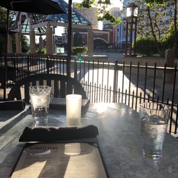 Wild River Grille - Patio seating with a view of the river. - New American Near Me - Reno, Nevada