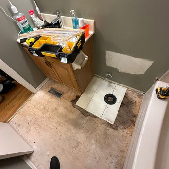 Reno and Repairs - a man standing in a bathroom - General Contractors Near Me - Markham, Ontario