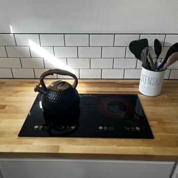All About U Construction - a tea kettle on a stovetop - General Contractors Near Me