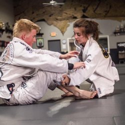 Triton Fight Center - Youths participate in fundamentals, advanced, and modern jiu-jitsu classes under the supervision of an adult instructor