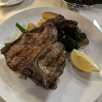 Grappa '72 Ristorante - Veal chop with roasted potatoes and rapini - Italian Near Me - Albany, New York Grappa '72 Ristorante - Veal chop with roasted potatoes and rapini - Italian Near Me - Albany, New York
