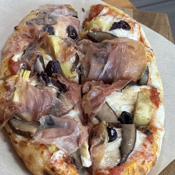 Pinsa 104 - Roman pizza with mushrooms, artichokes, black olives, and prosciutto - Pizza Near Me - Davie, Florida