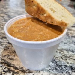 Bread-N-Brew - Small cup of chicken paprikash with a slice of bread