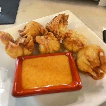 Sky Bar Steak and Sushi - Crab Rangoon, and a spicy sauce - Sushi Bars Near Me - Galveston, Texas Sky Bar Steak and Sushi - Crab Rangoon, and a spicy sauce - Sushi Bars Near Me - Galveston, Texas