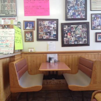 Royal Lunch - Booth with family and customer pics on the wall - Diners Near Me - Providence, Rhode Island