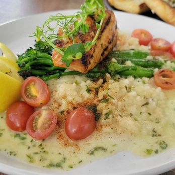 Eves Eatery - Grilled salmon with herb risotto and lemon sauce. - Pizza Near Me - Carson City, Nevada Eves Eatery - Grilled salmon with herb risotto and lemon sauce. - Pizza Near Me - Carson City, Nevada