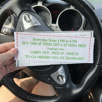 Jr’s Pizza Palace - a driver's hand holding a ticket - Pizza Near Me - Newton, Alabama Jr’s Pizza Palace - a driver's hand holding a ticket - Pizza Near Me - Newton, Alabama