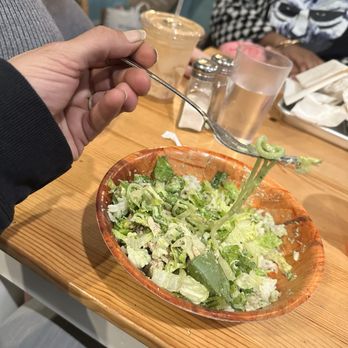 Zeke's - Greek Pita Bowl...holding up the "cucumbers" - Acai Bowls Near Me - Chesapeake, Virginia