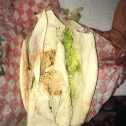 a wrap with meat and lettuce