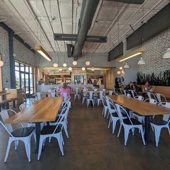 MotoMedi Mediterranean - a dining area with tables and chairs - Mediterranean Near Me - Lubbock, Texas