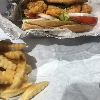 Phillyman Cheesesteak - Fried Shrimp PoBoy.... minus a bite or two...lol - Cheesesteaks Near Me - Nashville, Tennessee Phillyman Cheesesteak - Fried Shrimp PoBoy.... minus a bite or two...lol - Cheesesteaks Near Me - Nashville, Tennessee
