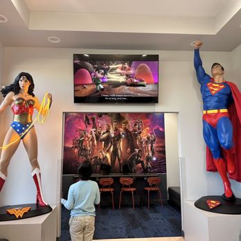 Cavitybusters Dentistry 4 Kids - Front desk area with iPads, movies, Superman and Wonder Woman and more - Pediatric Dentists Near Me - Las Vegas, Nevada