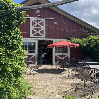 Sun High Orchard - a red barn with tables and umbrellas - Farmers Market Near Me - Randolph, New Jersey