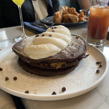 Marsh House - Chocolate and peanut butter pancakes with Mimosa, Bloody Mary and Chicken and Waffles - Southern Near Me - Nashville, Tennessee