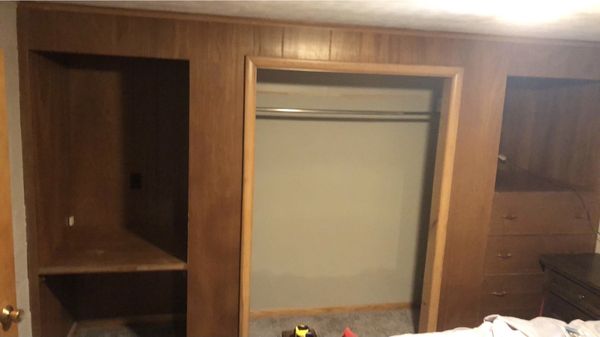 Closet remodel - This remodel was made with left over material a customer had and wanted to fix their sons bedroom giving him more space, we had the idea to transfer the middle closet space to the sides because he wasn’t using either side of the closet at all and leave the center for a nice space for his TV leaving a perfect amount of room to add a large dresser in the center aswell. This added up a ton of room and definitely made the space a lot more cozy. We changed the light fixture to a color changing smart light that just went perfectly with the vibe of the room and made turning on and off the light as simple as a click of a button, no more getting up to turn it off at night when you’re ready to sleep! Closet remodel - This remodel was made with left over material a customer had and wanted to fix their sons bedroom giving him more space, we had the idea to transfer the middle closet space to the sides because he wasn’t using either side of the closet at all and leave the center for a nice space for his TV leaving a perfect amount of room to add a large dresser in the center aswell. This added up a ton of room and definitely made the space a lot more cozy. We changed the light fixture to a color changing smart light that just went perfectly with the vibe of the room and made turning on and off the light as simple as a click of a button, no more getting up to turn it off at night when you’re ready to sleep!