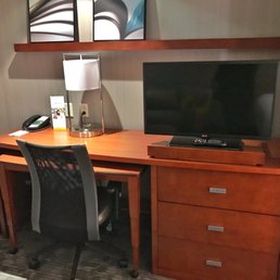 Chair is comfortable, TV is a bit small if watching from bed, perfect for viewing from the desk. Good in room movie system.