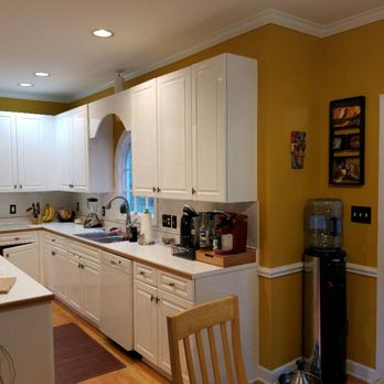 Diverse Homes - a kitchen with white cabinets and white appliances - General Contractors Near Me Diverse Homes - a kitchen with white cabinets and white appliances - General Contractors Near Me