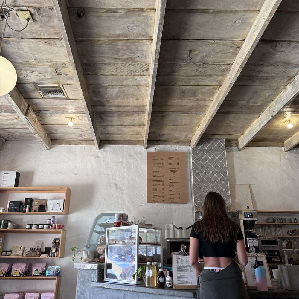 The Press Espresso - Drink menu is on the wall (brown board) and food menu is the white paper to the left of this lady in the picture. - Coffee & Tea Near Me - Temecula, California The Press Espresso - Drink menu is on the wall (brown board) and food menu is the white paper to the left of this lady in the picture. - Coffee & Tea Near Me - Temecula, California