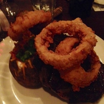 Rick's Chophouse - Cowboy ribeye steak with onion rings and loaded baked potato delicious - Seafood Near Me - McKinney, Texas Rick's Chophouse - Cowboy ribeye steak with onion rings and loaded baked potato delicious - Seafood Near Me - McKinney, Texas