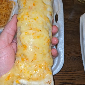 Don Beto's - a person holding a burrito - Mexican Near Me - Livonia, Michigan Don Beto's - a person holding a burrito - Mexican Near Me - Livonia, Michigan
