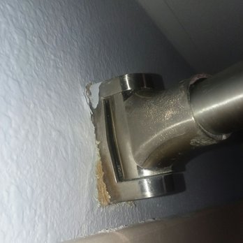 Marjac Suites - The shower curtain that is falling off the wall, thus the water all over the floor. - Hotels Near Me - Virginia Beach, Virginia