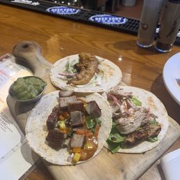 $2 HH taco Tuesday. Left to right - pork belly (salty), fish (rosemary heavy), chicken (moist, salty) $2 HH taco Tuesday. Left to right - pork belly (salty), fish (rosemary heavy), chicken (moist, salty)