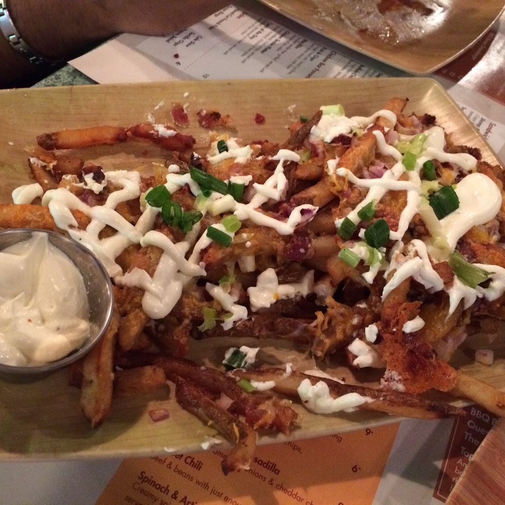 Sunset Grill - Loaded fries. Sour cream & cheese and bacon bits. - Casinos Near Me - Coconut Creek, Florida