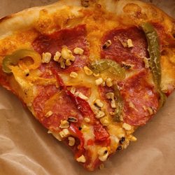 Market Hall Bakery - Slice of the Spicy Calabrese, Grilled Pepper & Corn Pizza with Hot Honey. About $7. Note: they charge an extra fee to heat it up.