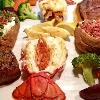 The Granary - a plate of lobster, broccoli, and baked potatoes - Steakhouses Near Me - Saskatoon, Saskatchewan