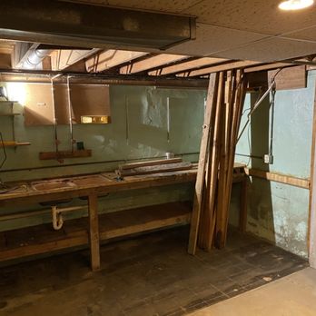 Handyman Adam - A dirty corner in a basement that will soon be a bathroom. - Handyman Near Me