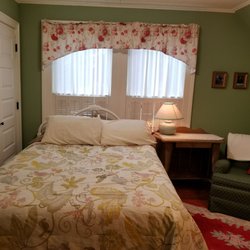Bedroom with hand painted sink (not seen, on right).